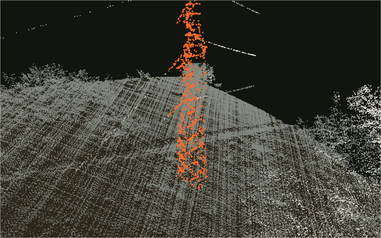 A public LiDAR scan around a 220 kV tower, with the ground segmented and the tower standing out in orange.